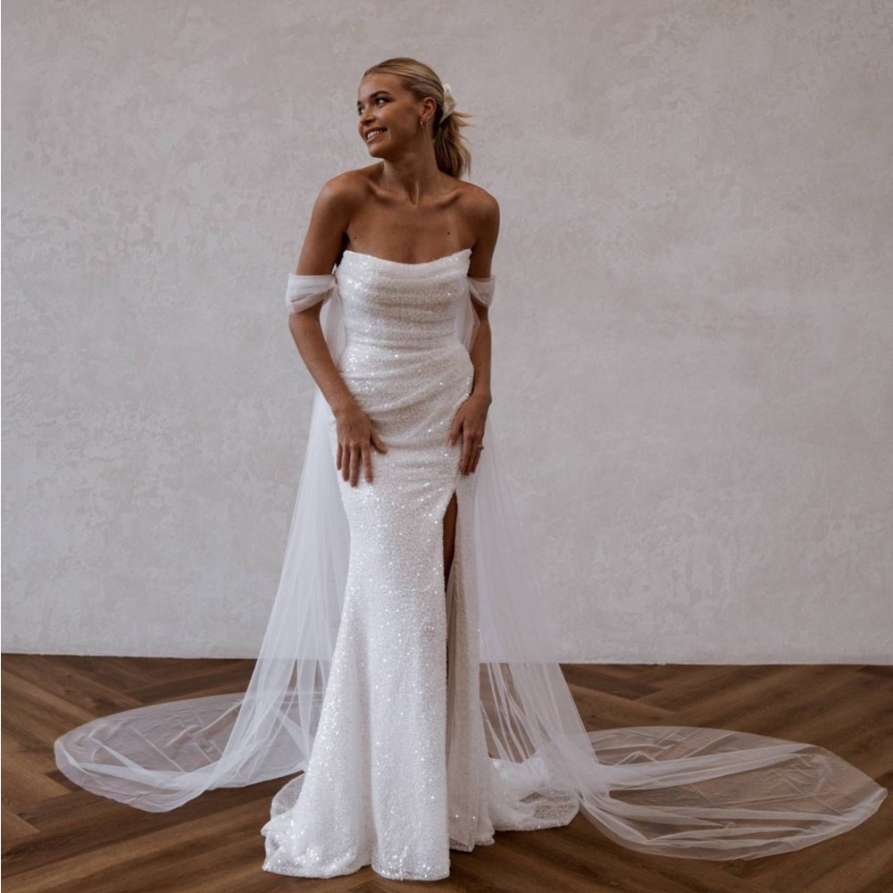Off-Shoulder White Sequin Wedding Gown with Sheer Draped Train